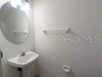 a bathroom with a sink and mirror