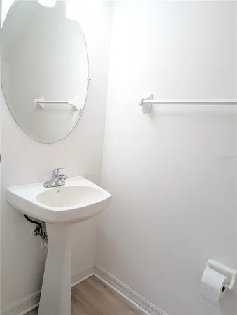 a bathroom with a sink a mirror and a shower