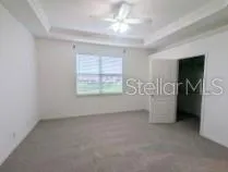 an empty room with windows and entrance