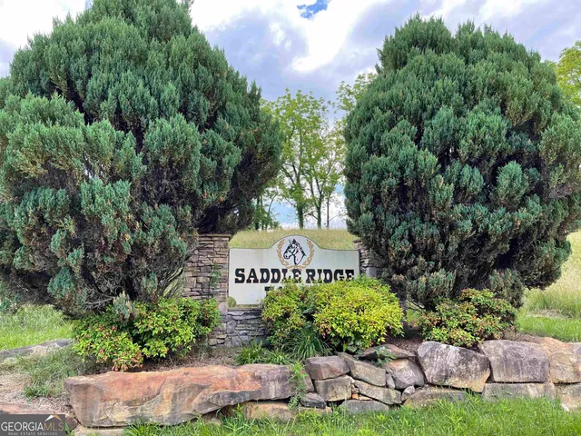 a sign that is sitting in a garden