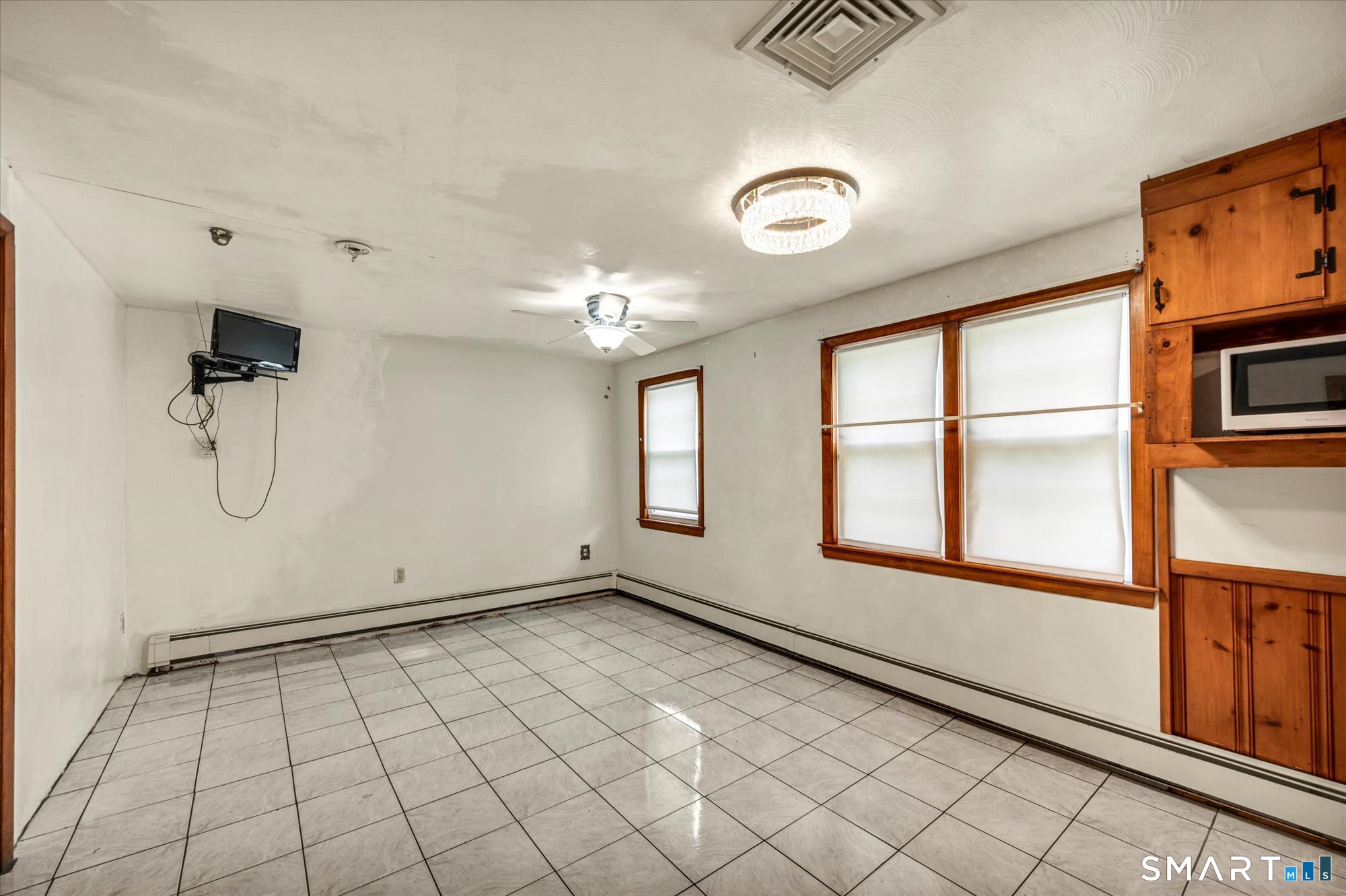 740 Rainbow Road Windsor, CT 06095 - Photo 16 of 40 a view of an empty room with a window