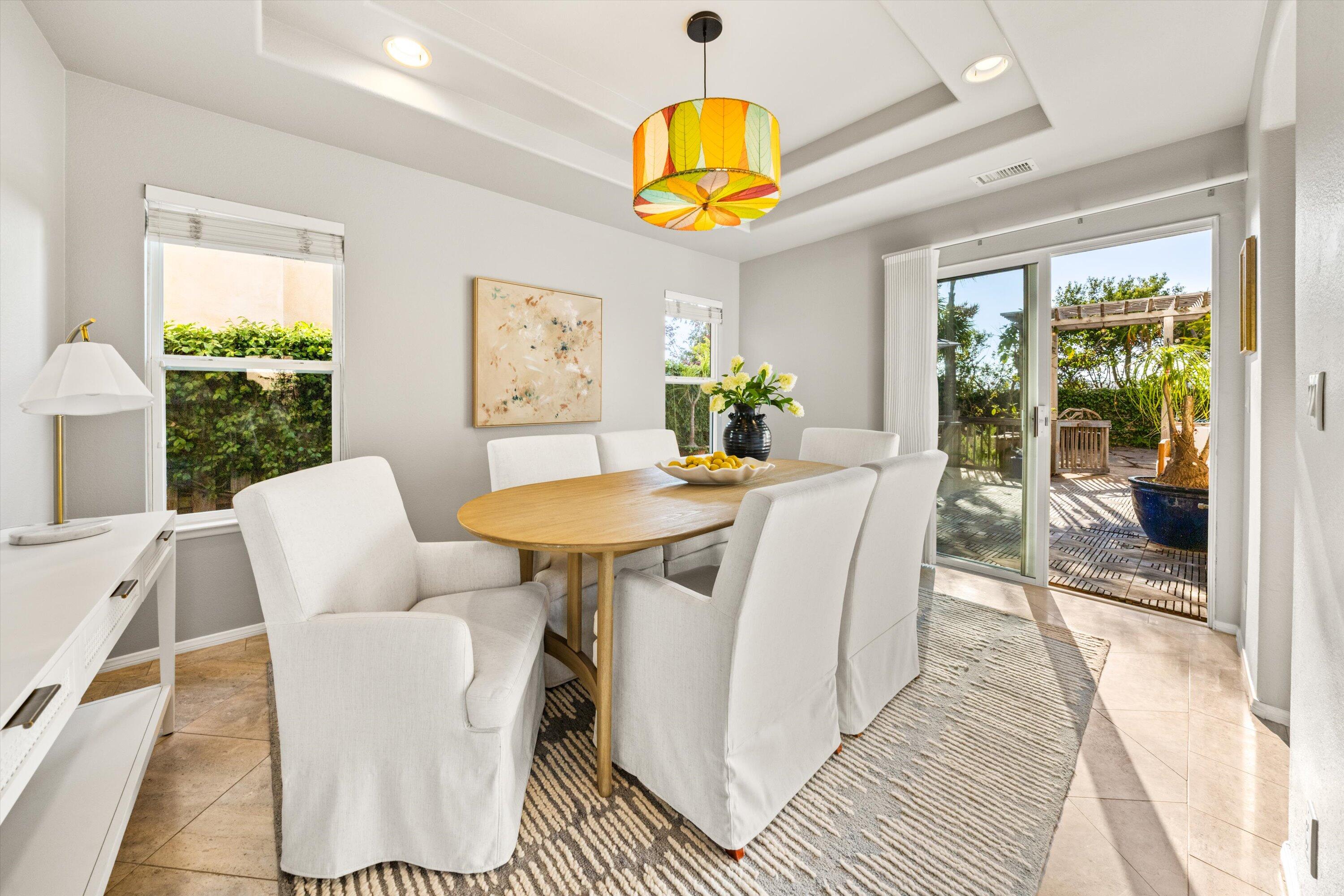7926 Winchester Circle Goleta, CA 93117 - Photo 15 of 56 a view of a dining room with furniture window and wooden floor