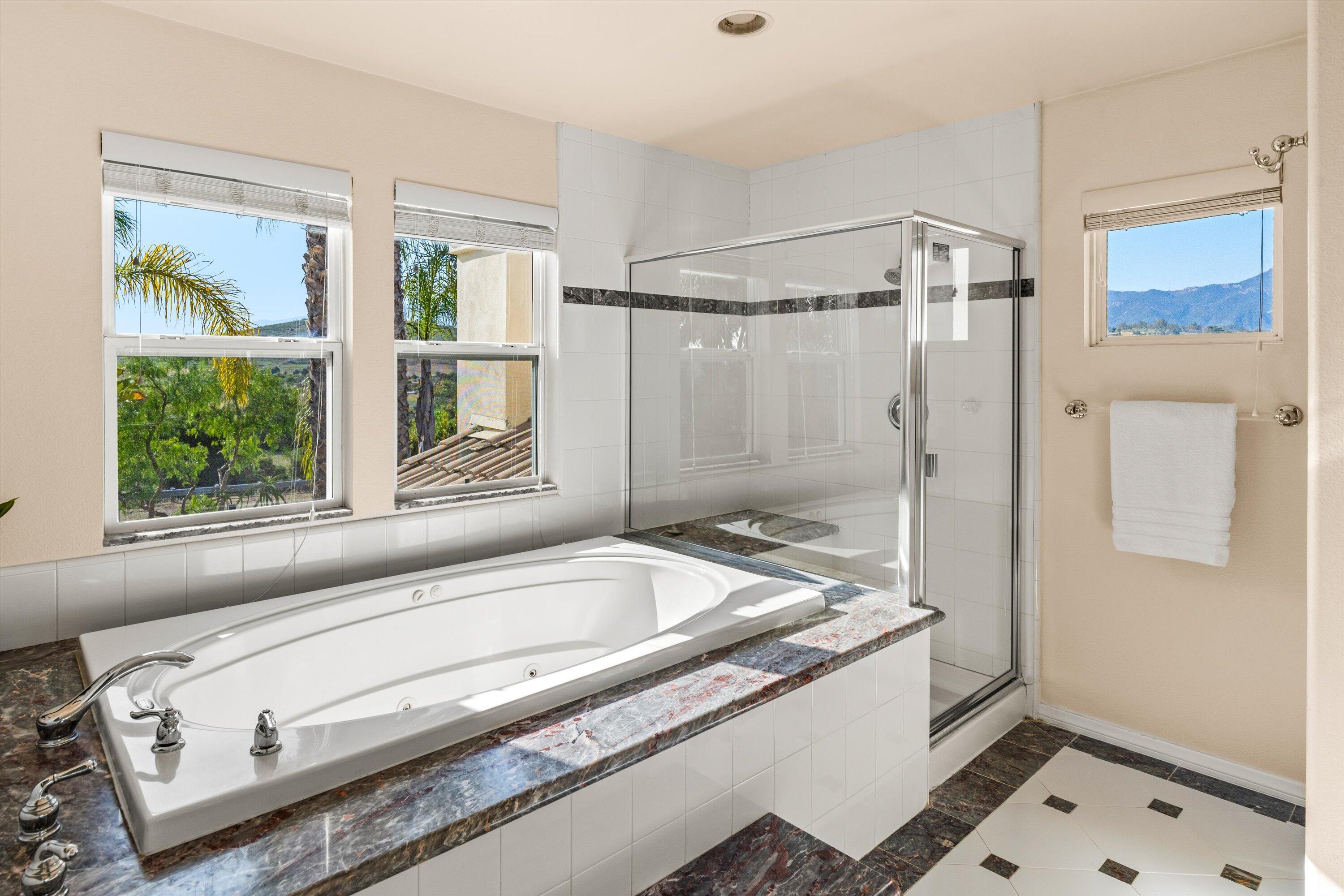7926 Winchester Circle Goleta, CA 93117 - Photo 22 of 56 a bath tub sitting next to a window