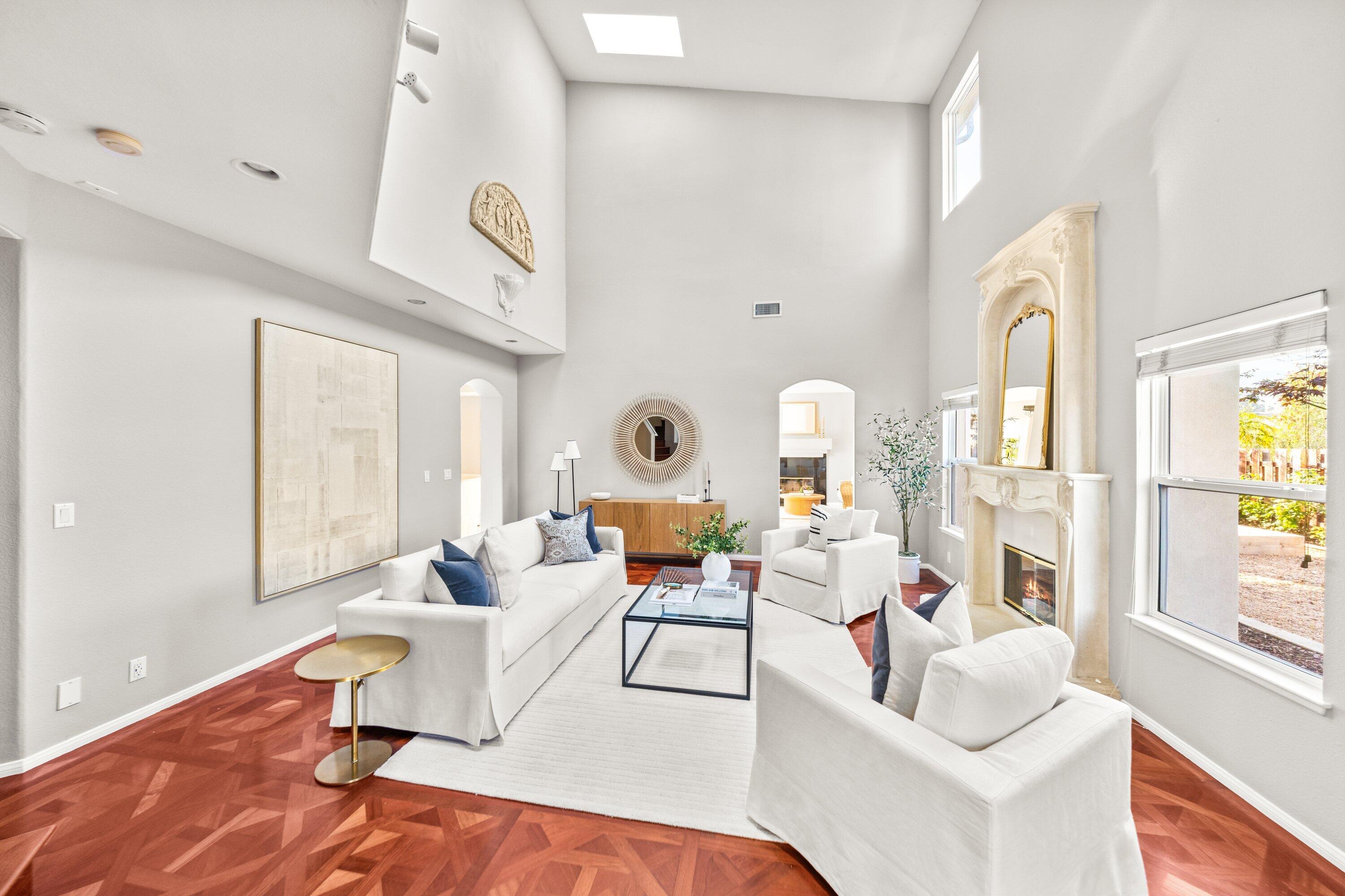 7926 Winchester Circle Goleta, CA 93117 - Photo 7 of 56 a living room with fireplace furniture and a large window