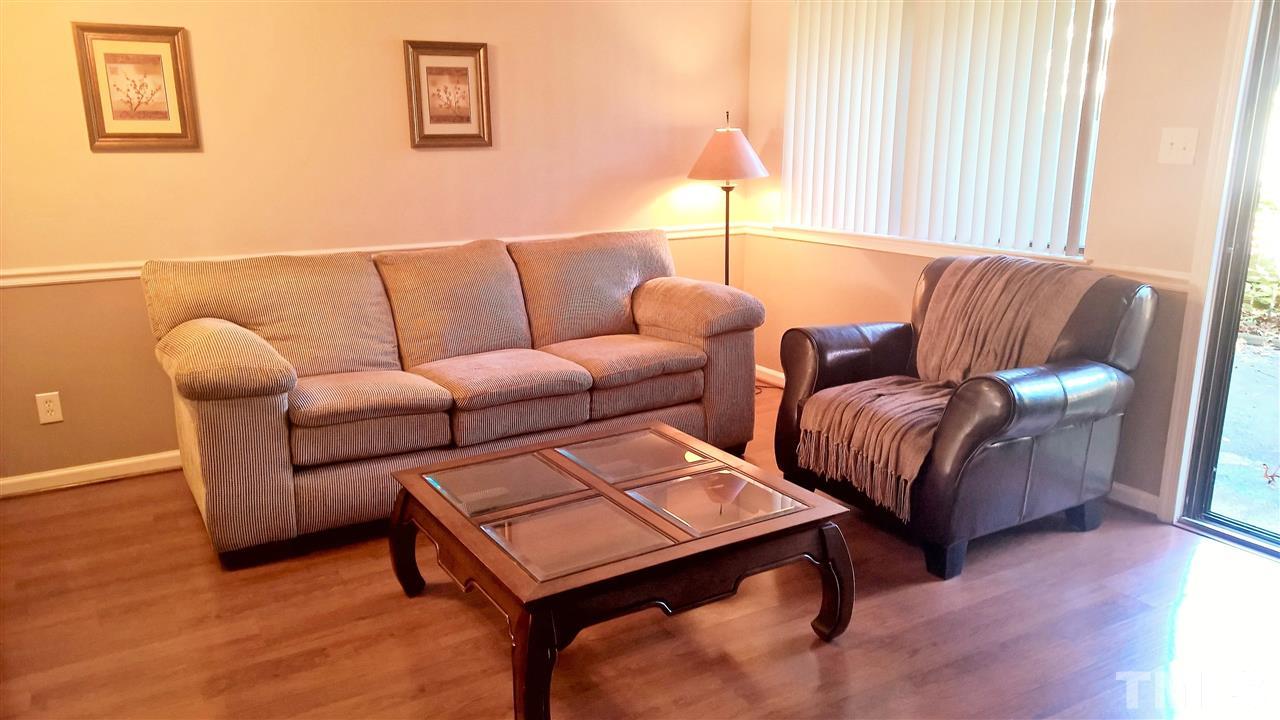 4269 Lake Ridge Drive Raleigh, NC 27604 - Photo 2 of 21 a living room with furniture and a lamp