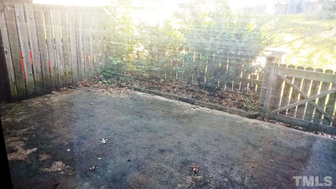 4269 Lake Ridge Drive Raleigh, NC 27604 - Photo 16 of 21 a view of a yard with trees in the background