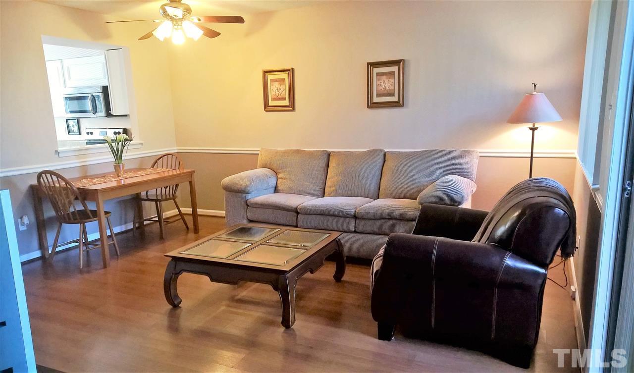 4269 Lake Ridge Drive Raleigh, NC 27604 - Photo 4 of 21 a living room with furniture a window and a table