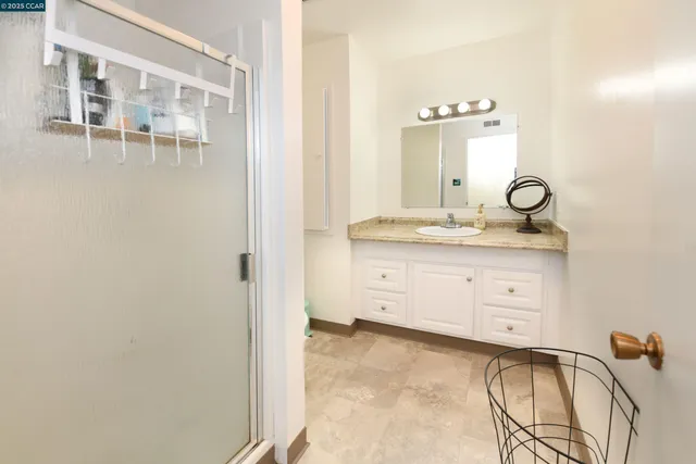 a view of bathroom with dual sinks