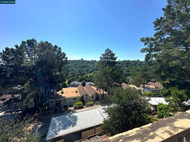 a view of house with a yard