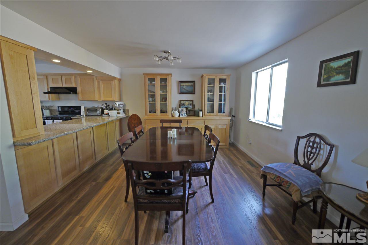 1010 Tudor Court Reno, NV 89503 - Photo 5 of 17 a view of a dining room with furniture window and wooden floor