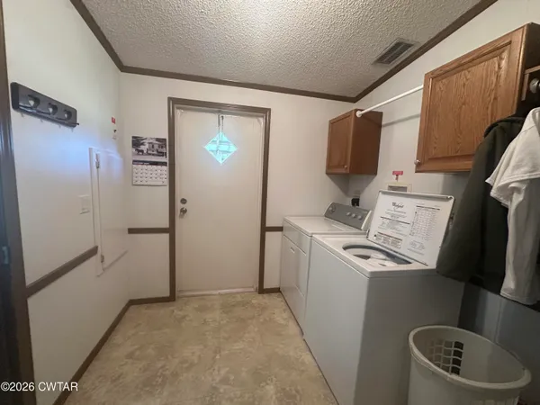a kitchen with a refrigerator and a stove