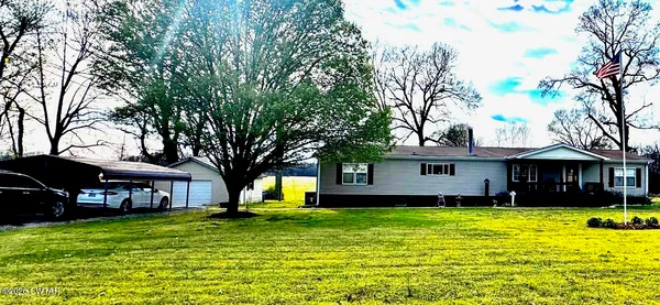 a house view with a backyard space
