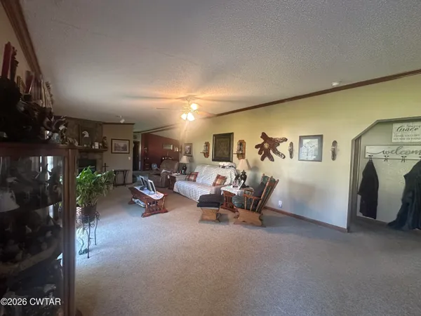 a lobby with furniture and potted plants