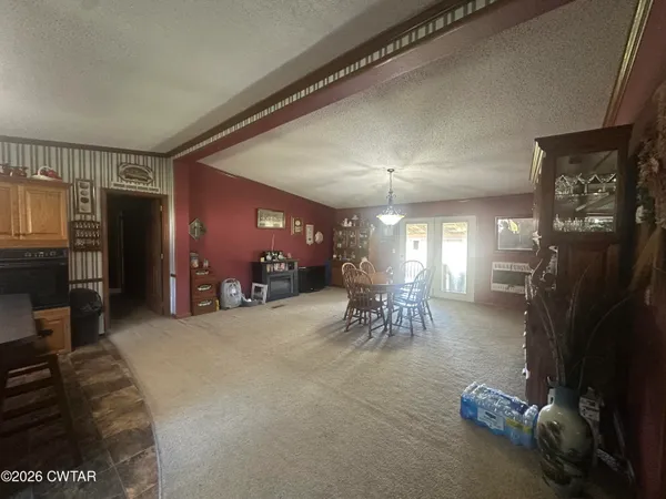 a view of a livingroom with furniture and a garage