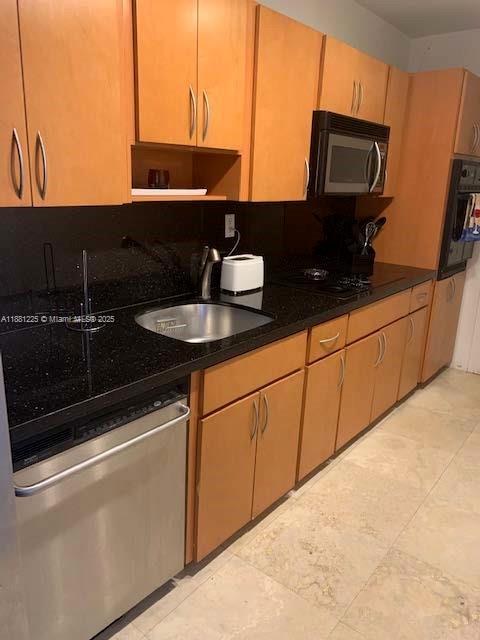 100 Lincoln Road, Unit 1438 Miami Beach, FL 33139 - Photo 5 of 31 a kitchen with a sink and cabinets