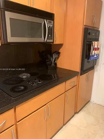 a kitchen with a stove and a microwave