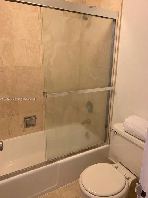 100 Lincoln Road, Unit 1438 Miami Beach, FL 33139 - Photo 10 of 31 a white toilet sitting next to a bath tub and a shower