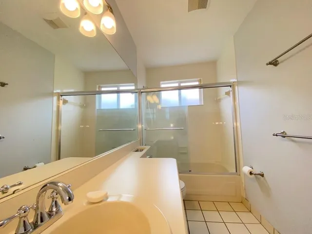 a bathroom with a bathtub and shower