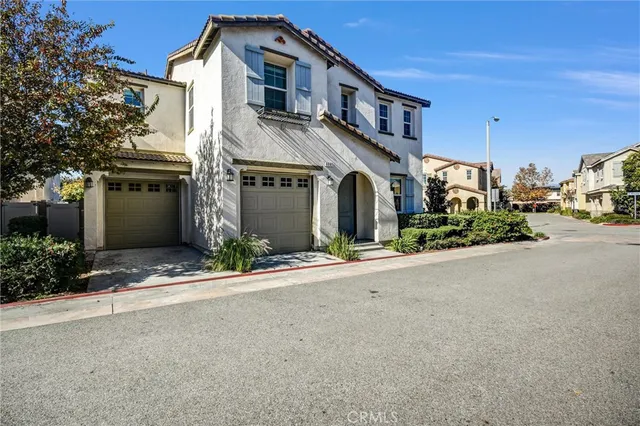 a view of a house with a street