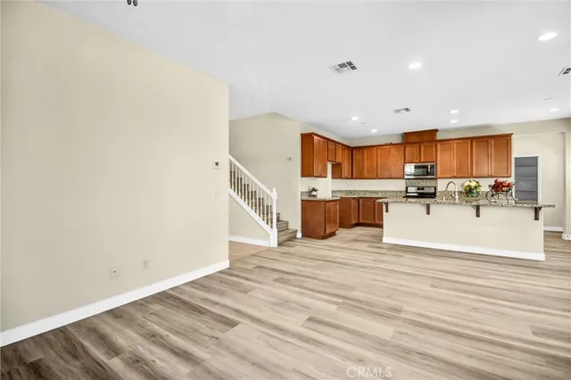 a view of kitchen with cabinets and wooden floor