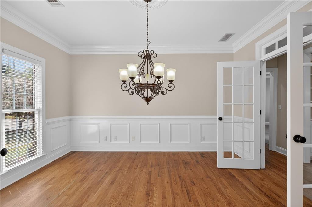 129 Oak Walk Villa Rica, GA 30180 - Photo 11 of 78 a view of an empty room with wooden floor and a window
