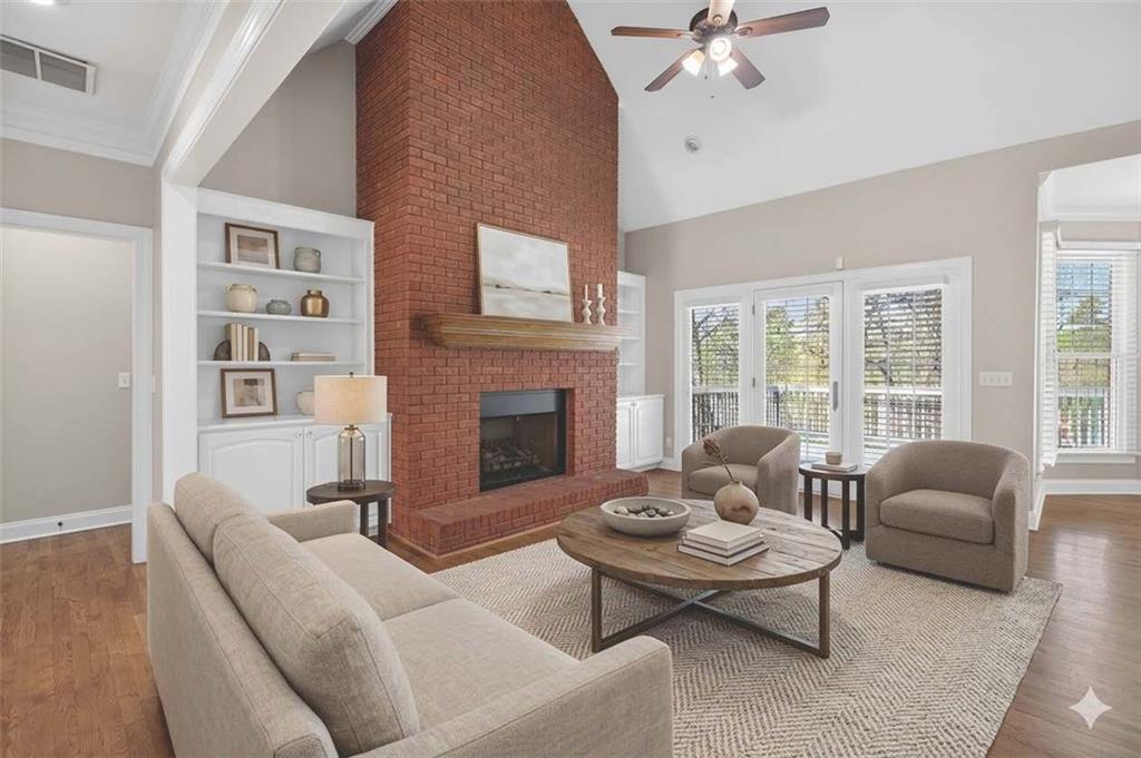 129 Oak Walk Villa Rica, GA 30180 - Photo 14 of 78 a living room with furniture fireplace and a large window