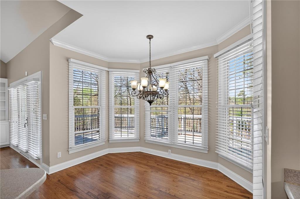 129 Oak Walk Villa Rica, GA 30180 - Photo 17 of 78 a view of an empty room with wooden floor and a window