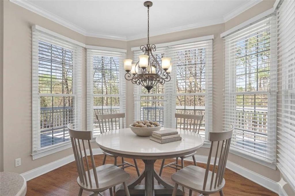 129 Oak Walk Villa Rica, GA 30180 - Photo 18 of 78 a view of a dining room with furniture window and wooden floor