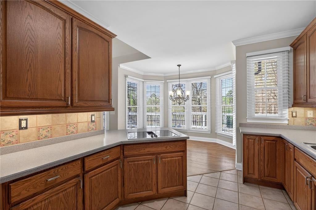 129 Oak Walk Villa Rica, GA 30180 - Photo 22 of 78 a large kitchen with granite countertop a sink and a window