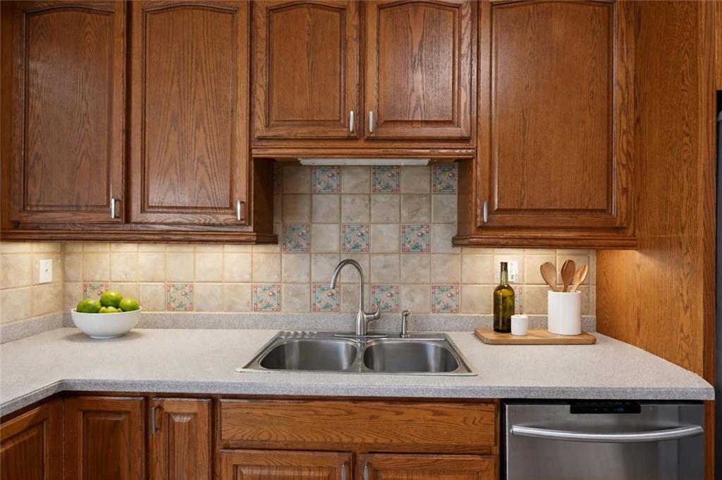 129 Oak Walk Villa Rica, GA 30180 - Photo 24 of 78 a kitchen with stainless steel appliances granite countertop a sink and cabinets