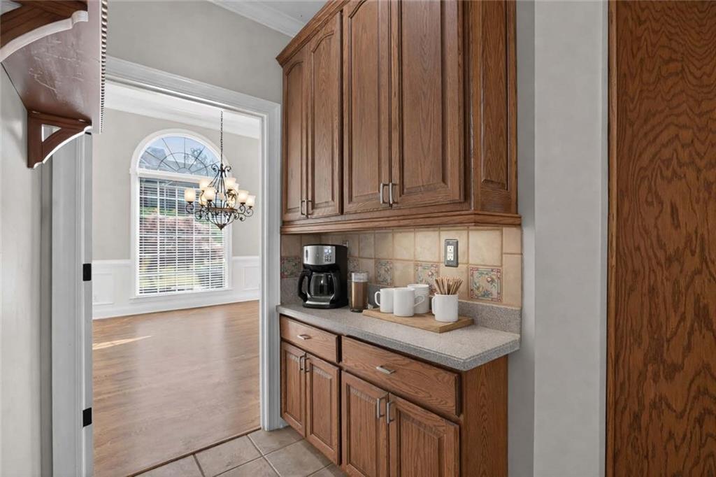 129 Oak Walk Villa Rica, GA 30180 - Photo 26 of 78 a kitchen with a sink cabinets and a window