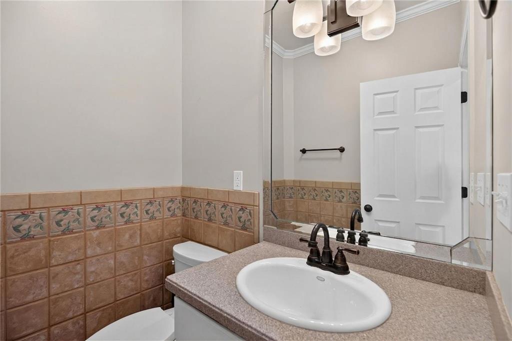 129 Oak Walk Villa Rica, GA 30180 - Photo 28 of 78 a bathroom with a sink a toilet and shower