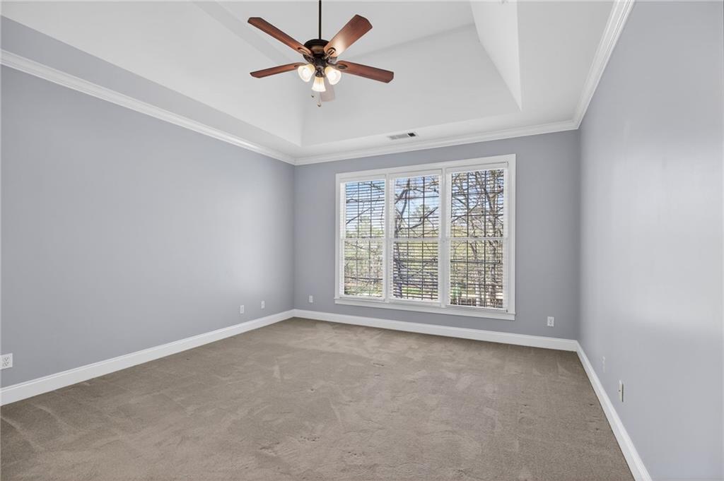 129 Oak Walk Villa Rica, GA 30180 - Photo 29 of 78 an empty room with a window and a fan