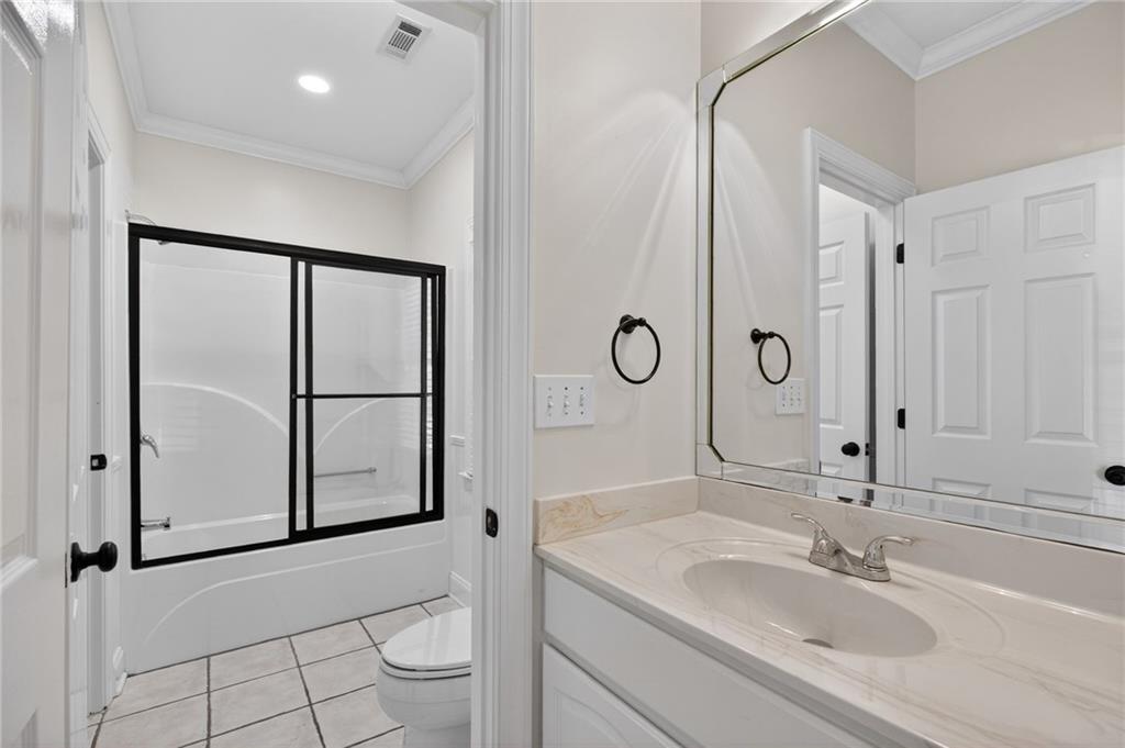 129 Oak Walk Villa Rica, GA 30180 - Photo 39 of 78 a bathroom with a sink a toilet and shower