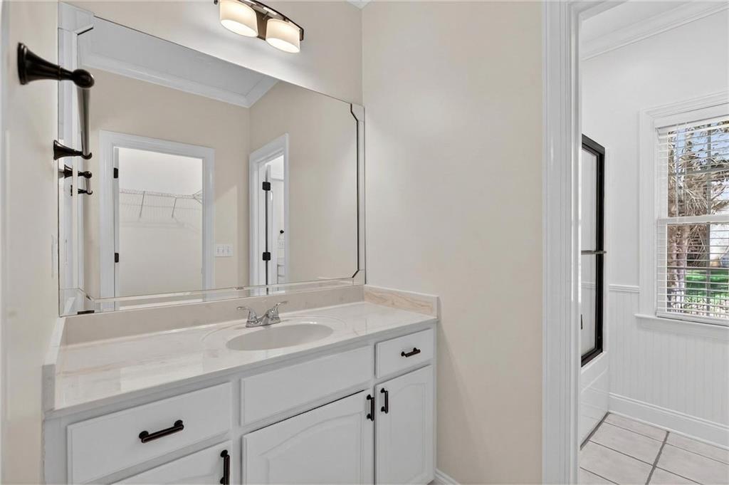 129 Oak Walk Villa Rica, GA 30180 - Photo 40 of 78 a bathroom with a sink vanity granite and a mirror