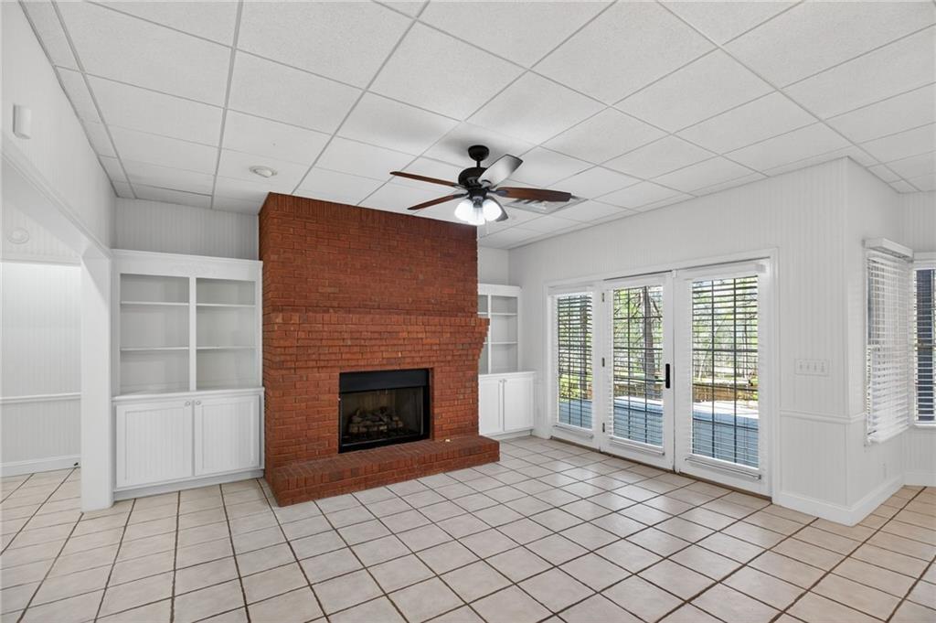 129 Oak Walk Villa Rica, GA 30180 - Photo 48 of 78 a view of an empty room with a fireplace and a window