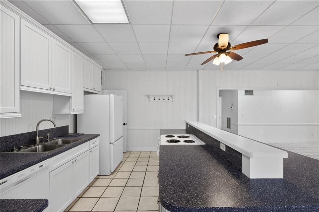 129 Oak Walk Villa Rica, GA 30180 - Photo 53 of 78 a kitchen with stainless steel appliances granite countertop a sink a stove counter space and cabinets
