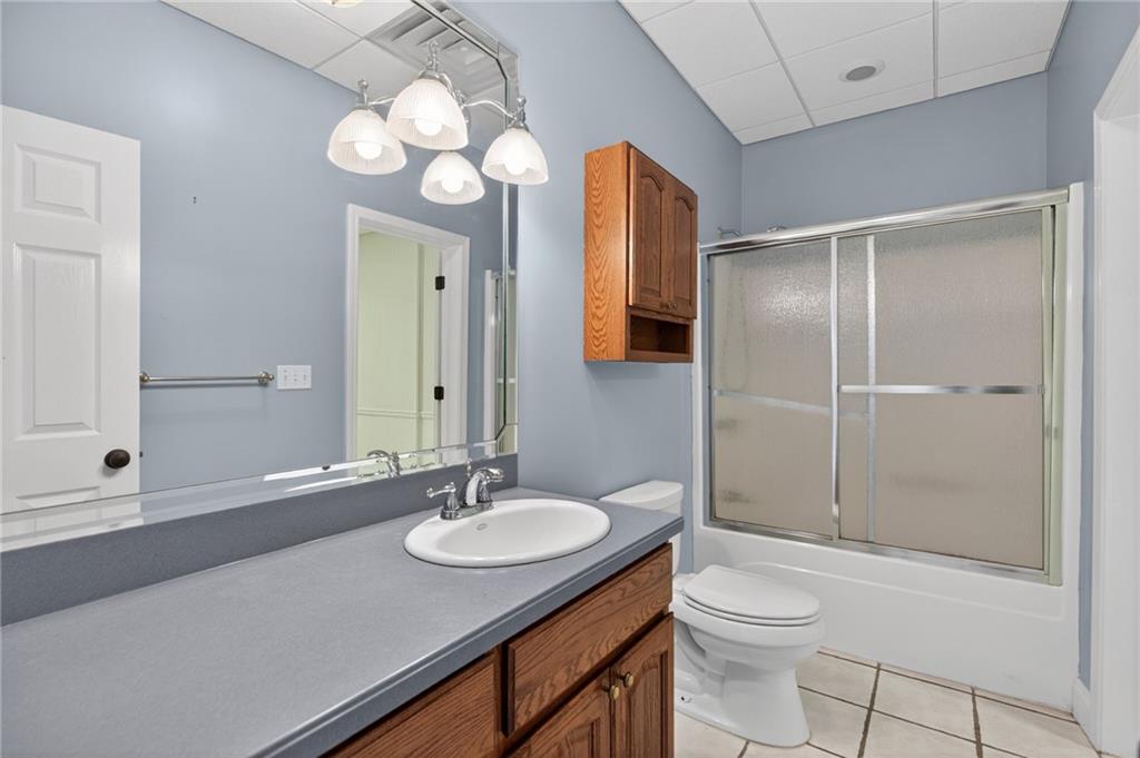 129 Oak Walk Villa Rica, GA 30180 - Photo 62 of 78 a bathroom with a sink vanity granite toilet and shower