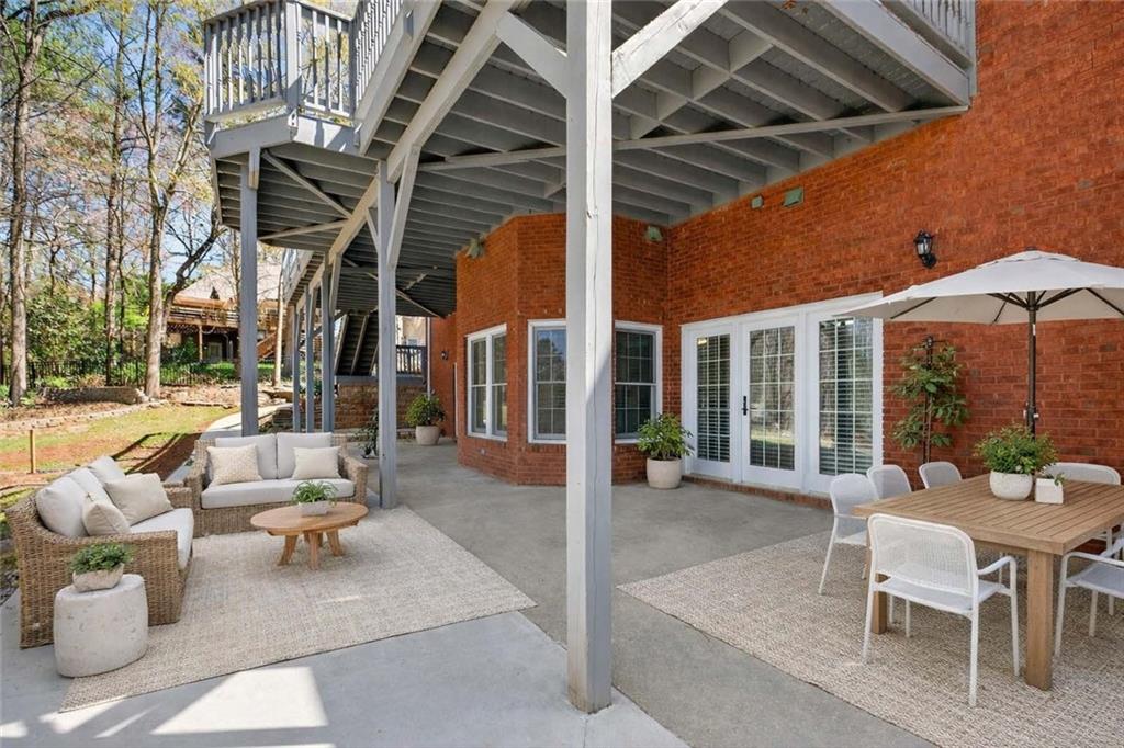 129 Oak Walk Villa Rica, GA 30180 - Photo 68 of 78 a view of a patio with couches and potted plants