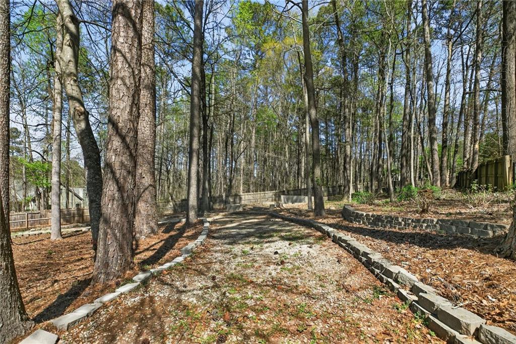 129 Oak Walk Villa Rica, GA 30180 - Photo 70 of 78 a view of a yard with large trees