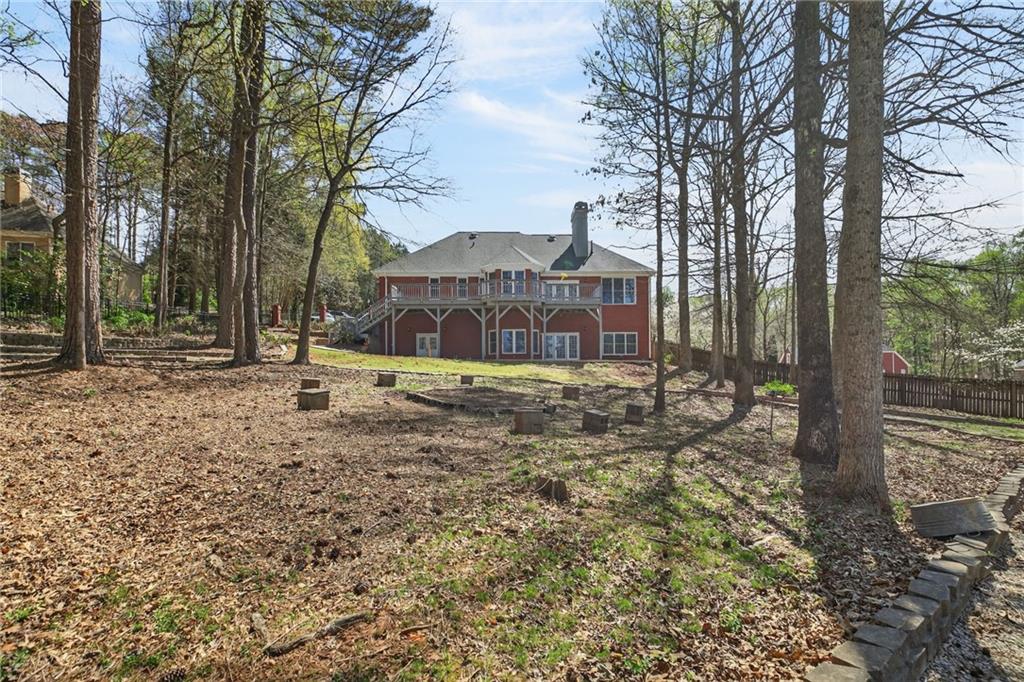 129 Oak Walk Villa Rica, GA 30180 - Photo 72 of 78 a backyard of a house with lots of green space