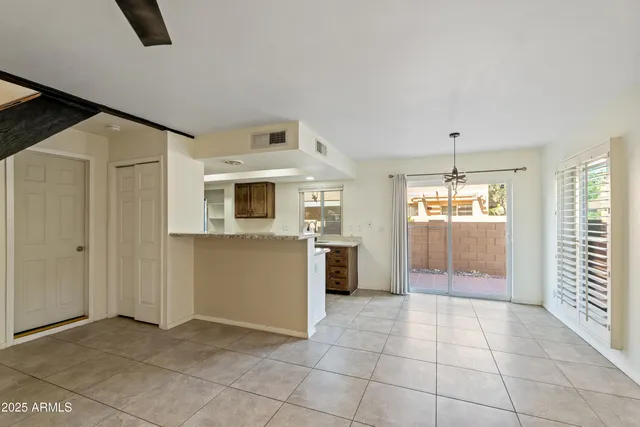 a view of a kitchen with a sink and dishwasher cabinets