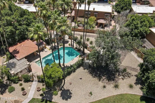 an aerial view of a house with a yard