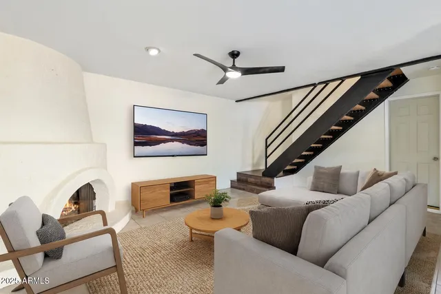 a living room with furniture and a flat screen tv
