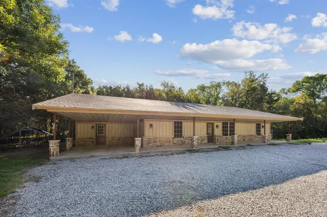 a view of house with outdoor space and porch