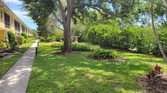 a view of a garden with a fountain