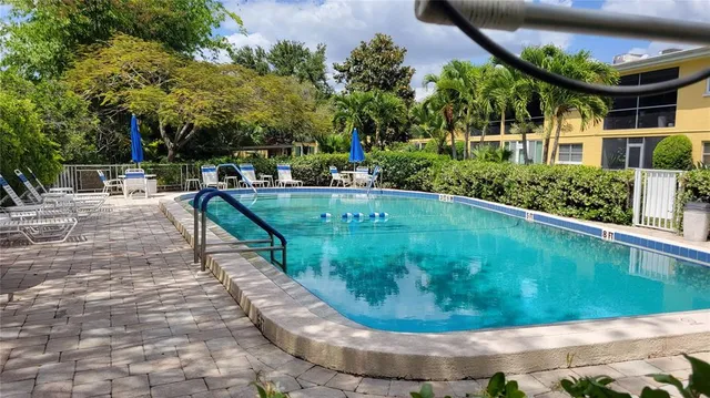 a view of a backyard with sitting area