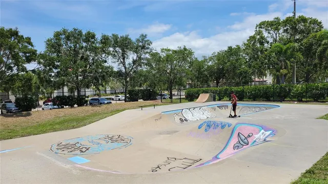 a view of a house with swimming pool and sitting area