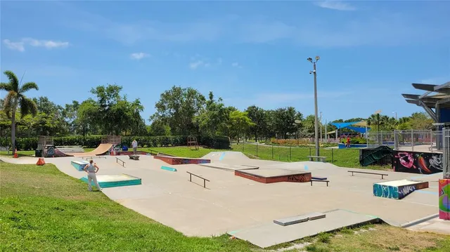 a store with outdoor seating area and swing