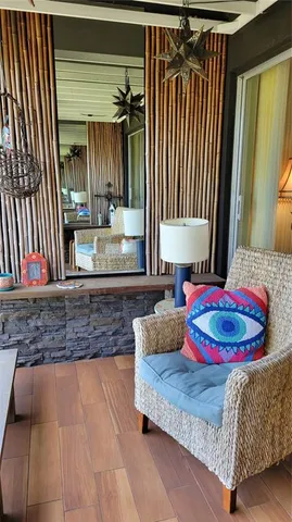 a living room with a couch and a rug